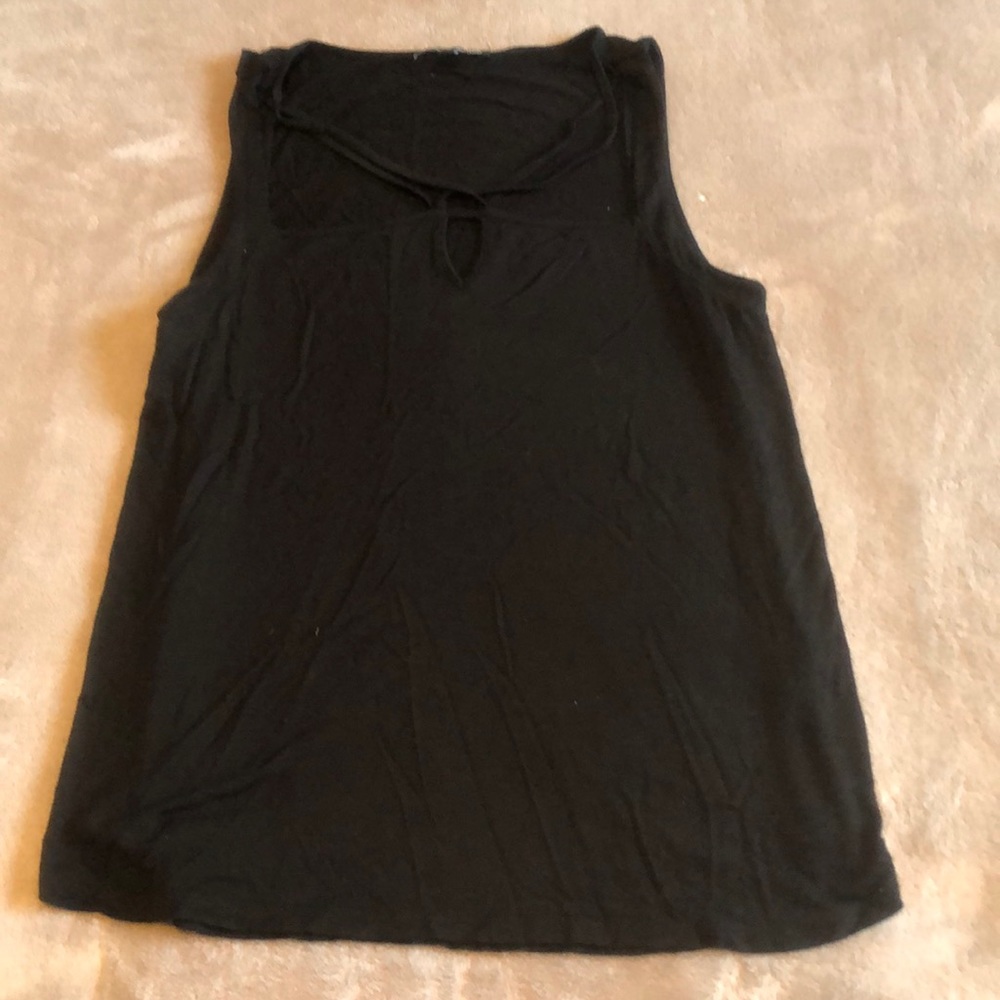 Black shirt with cross cross at collar bone
